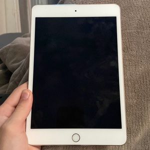 IPad mini, works like it’s new, lock button is sticky sometimes.